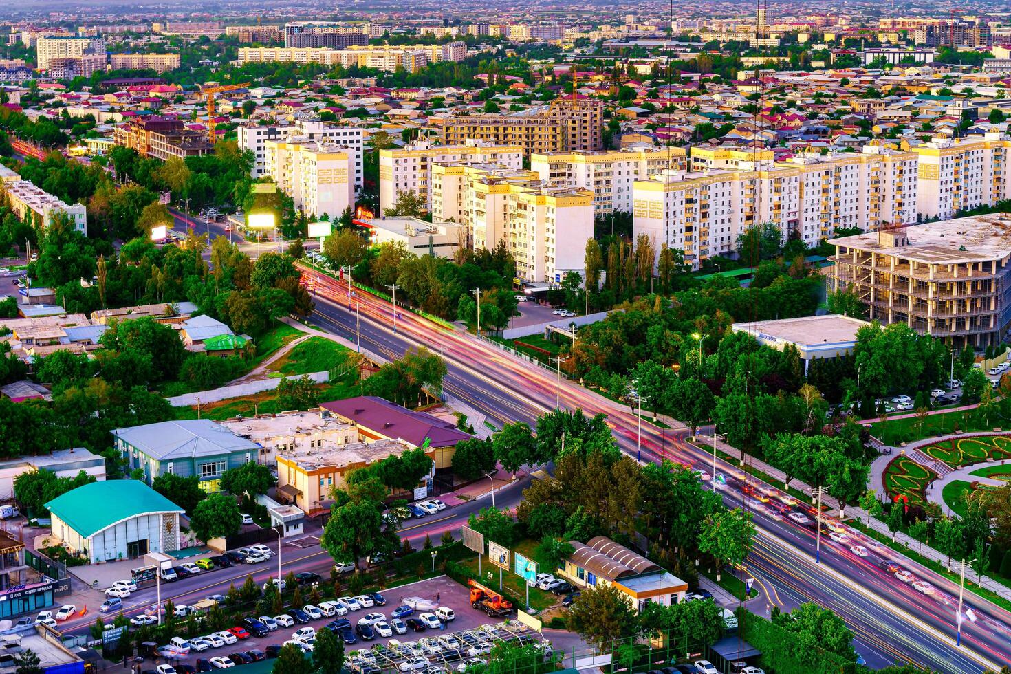 Uzbekistan, Tashkent - April 24, 2023 Top view from the observation deck on the Tashkent TV tower to the central part of the city during the twilight. photo