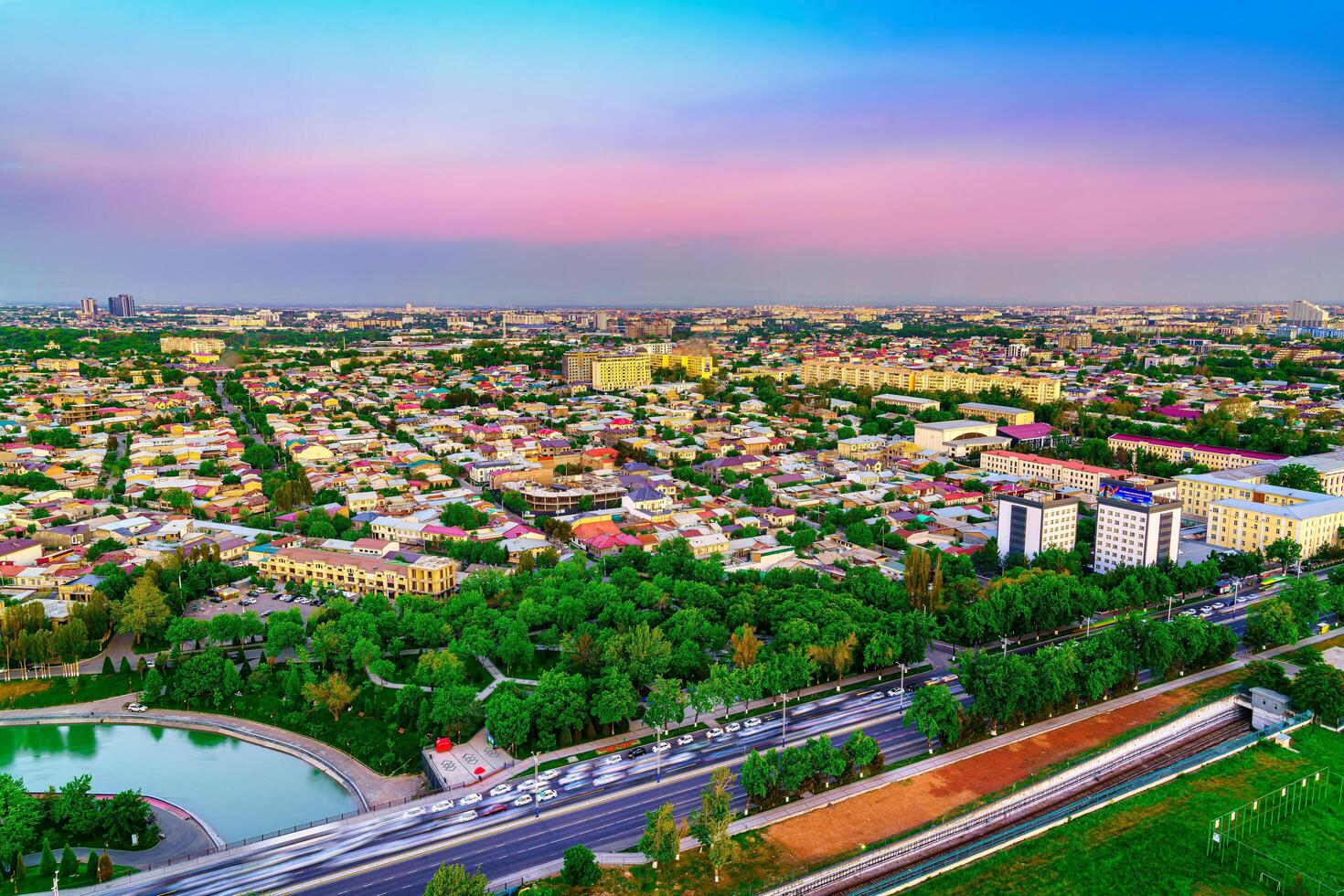 Uzbekistan, Tashkent - April 24, 2023 Top view from the observation deck on the Tashkent TV tower to the central part of the city during the twilight. photo