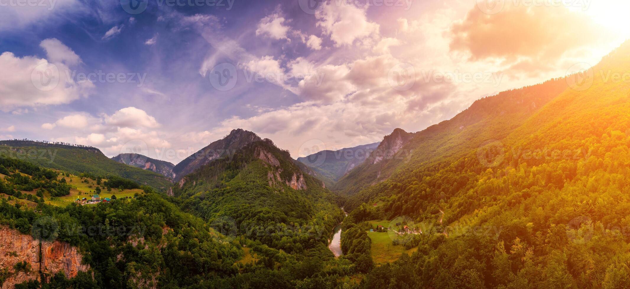 Panorama of high mountains of Tara river canyon at sunset with cloudy sky. photo