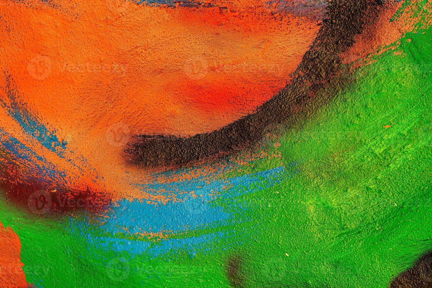 A fragment of colorful graffiti painted on a wall. Abstract urban background. Spray painting art. photo
