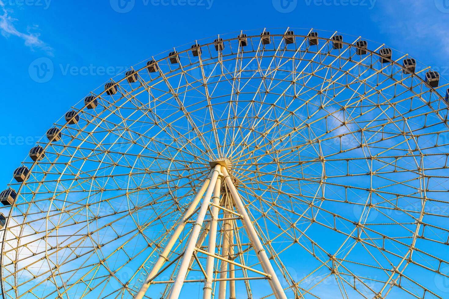 High ferris wheel at sunset or sunrise with cloudy sky background. photo