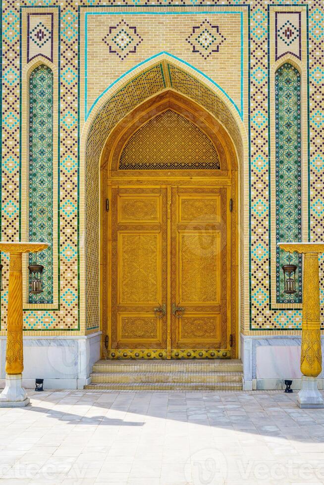 Carved wooden doors with patterns and mosaics. photo