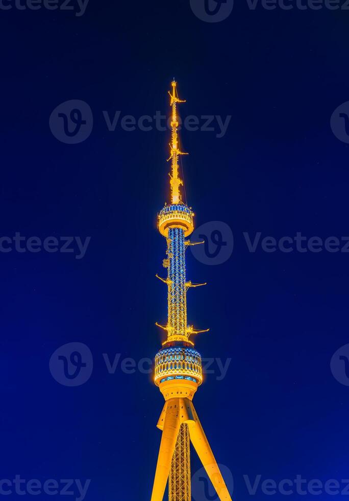 Tashkent television tower illuminated by night illumination at nighttime. photo