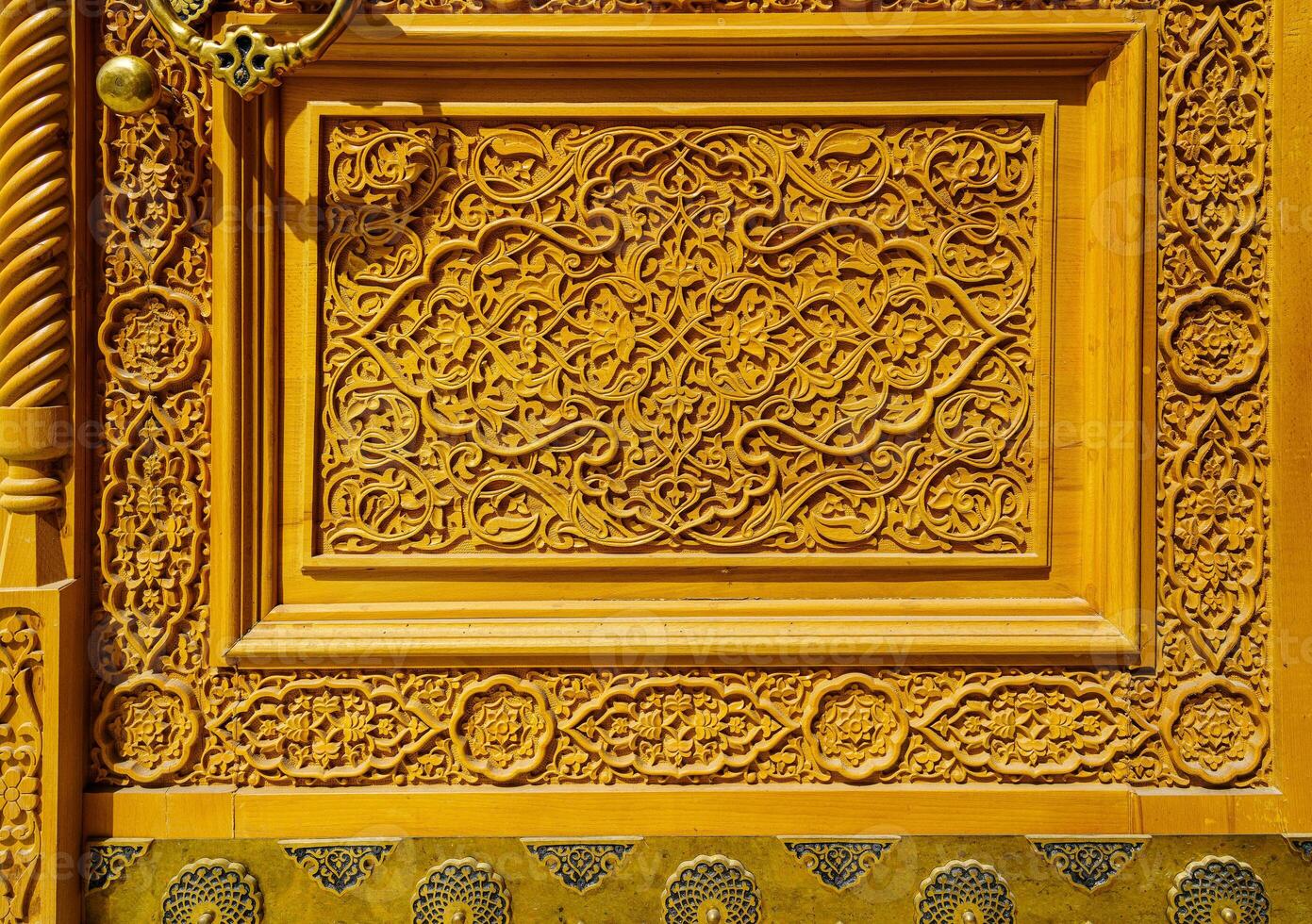 Fragment of a carved wooden door. Ornate. photo