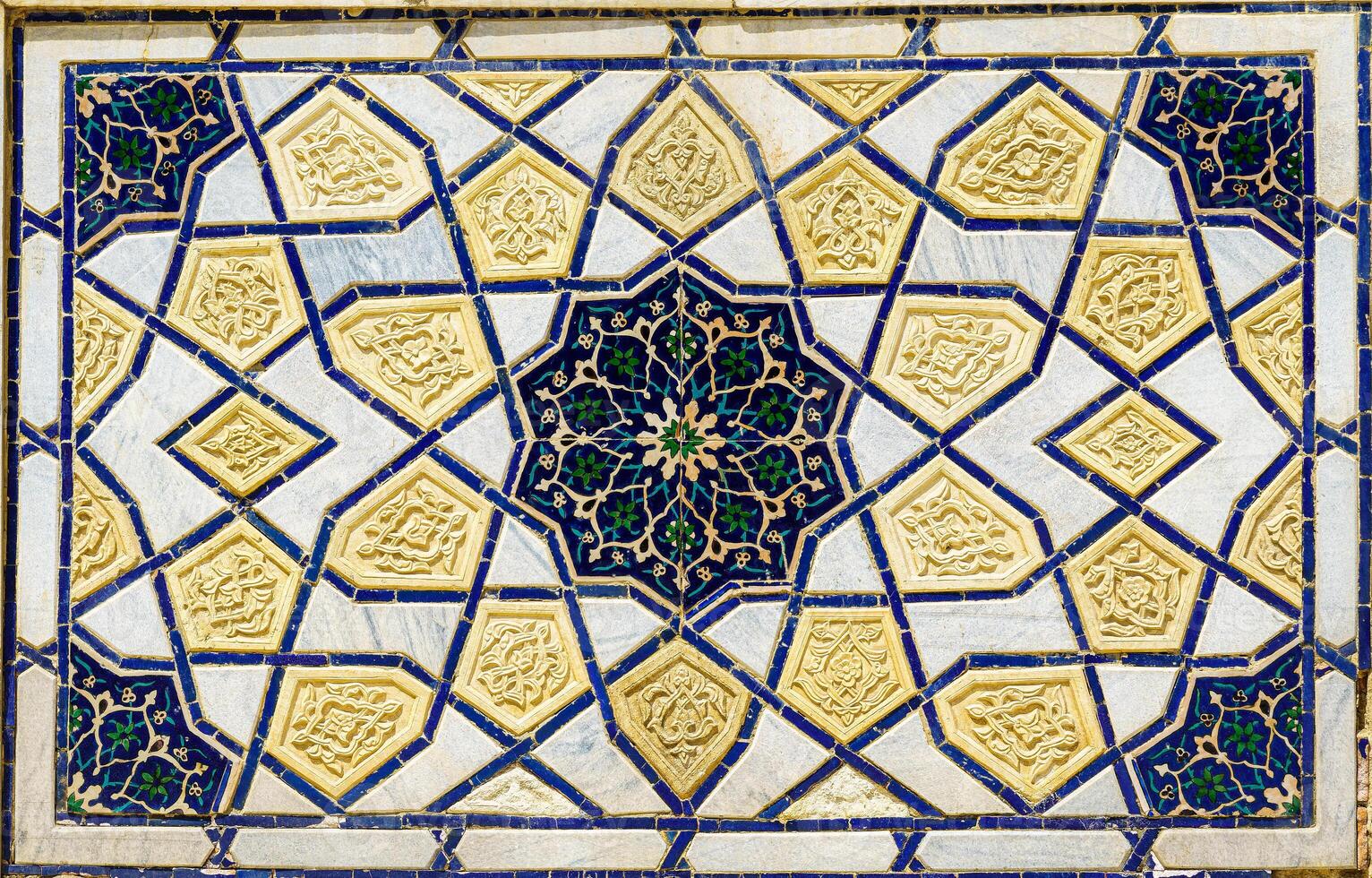 Geometric traditional Islamic ornament. Fragment of a ceramic mosaic. photo