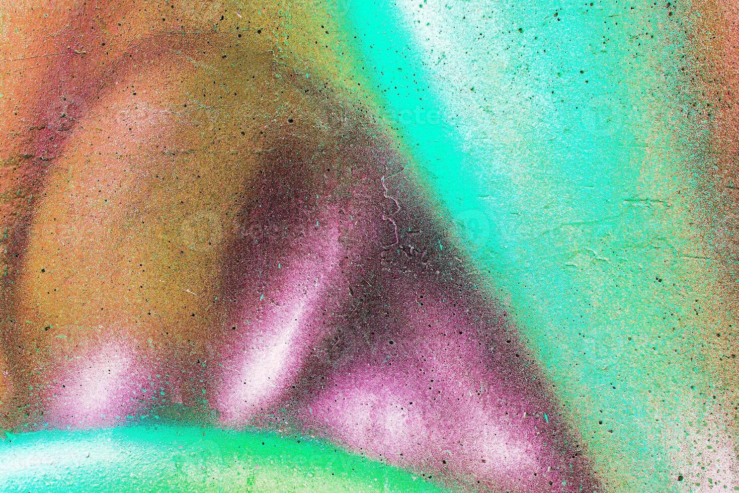Colorful graffiti painted on a wall. Abstract urban background. Spray painting art. photo