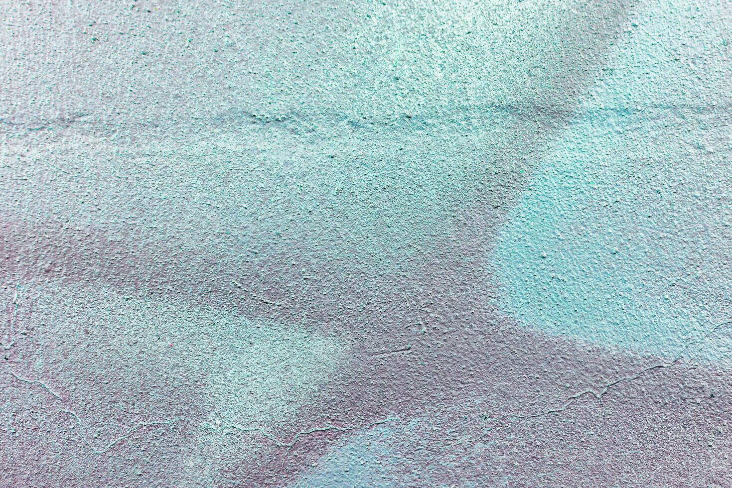 Colorful graffiti painted on a wall. Abstract urban background. Spray painting art. photo