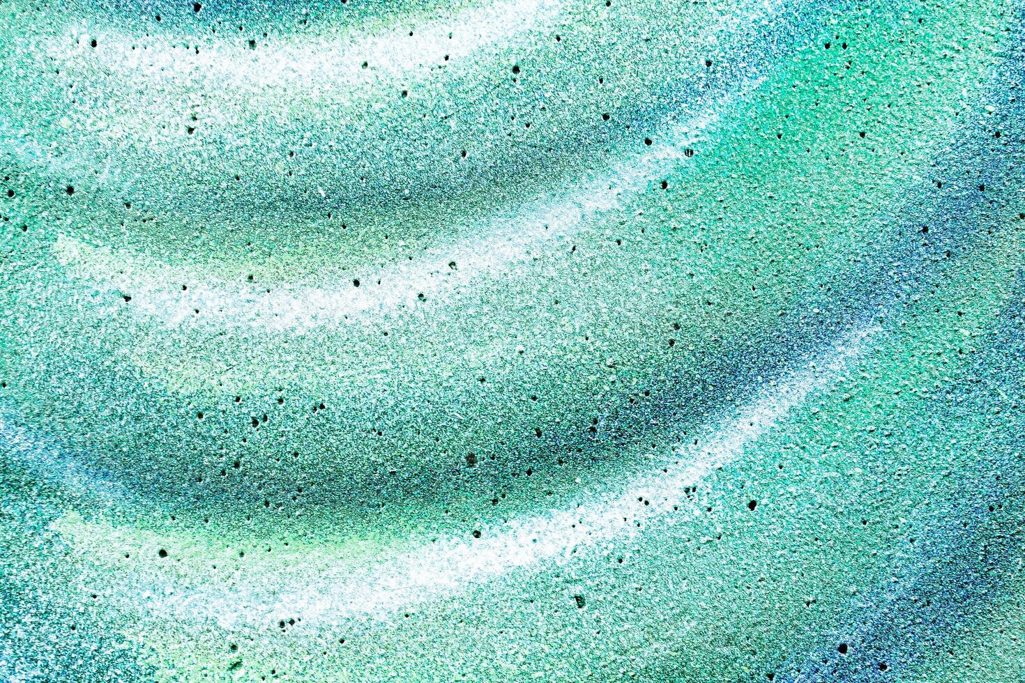 Colorful graffiti painted on a wall. Abstract urban background. Spray painting art. photo