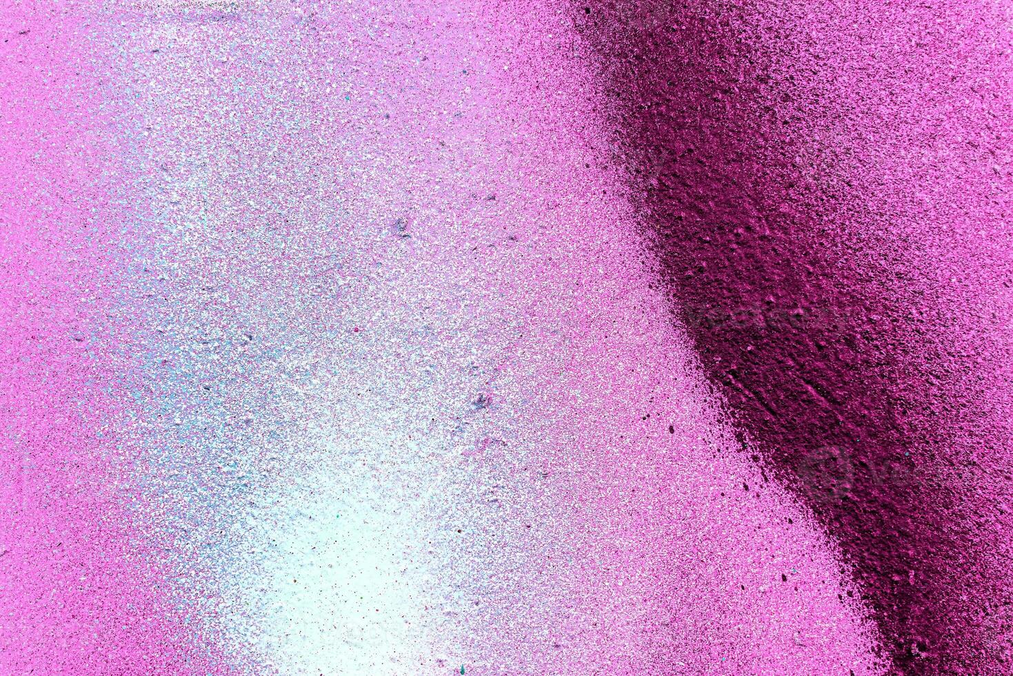 Colorful graffiti painted on a wall. Abstract urban background. Spray painting art. photo