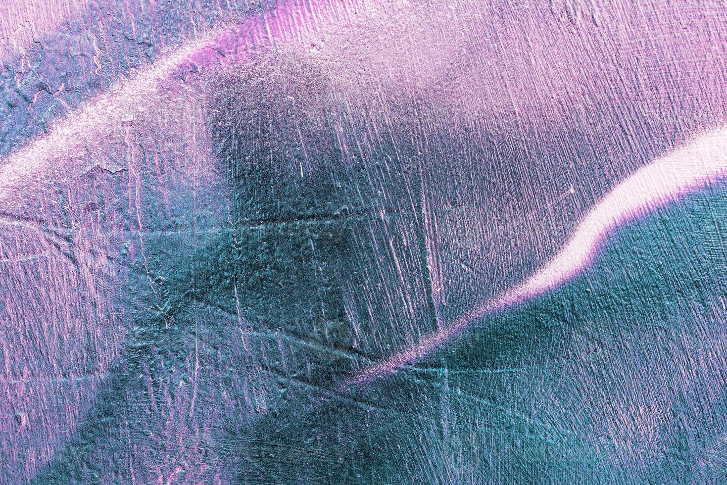 Colorful graffiti painted on a wall. Abstract urban background. Spray painting art. photo