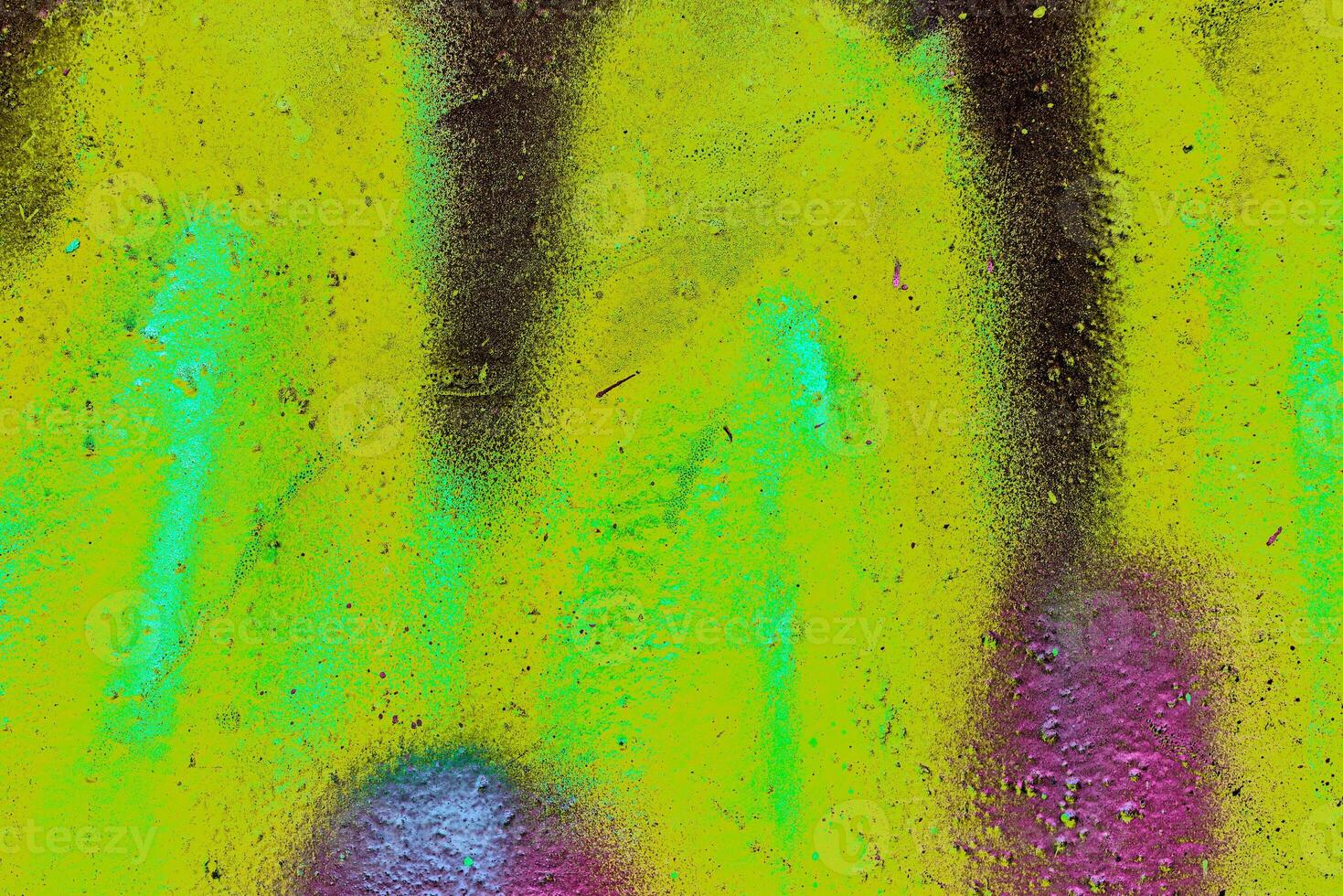 Colorful graffiti painted on a wall. Abstract urban background. Spray painting art. photo