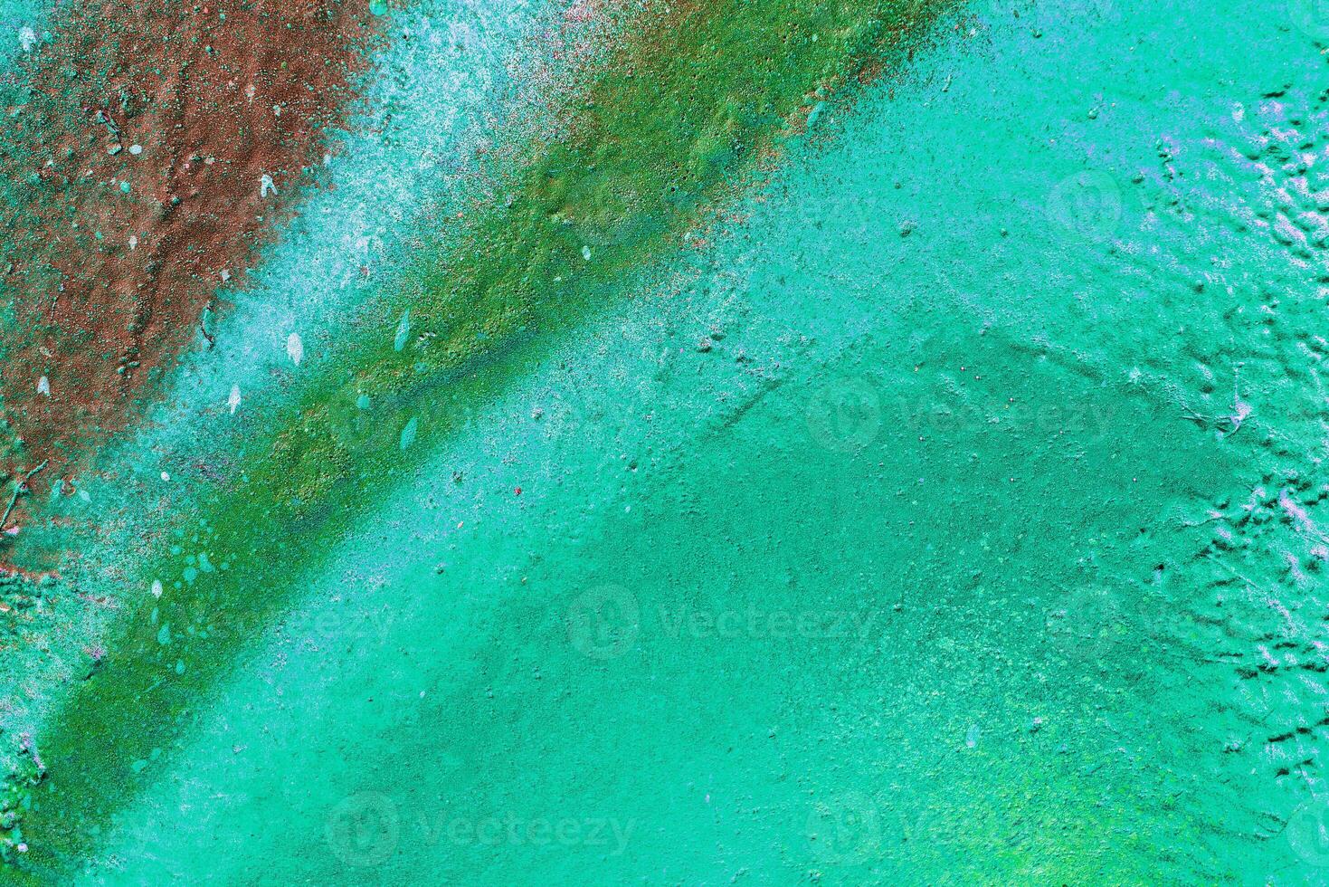 Colorful graffiti painted on a wall. Abstract urban background. Spray painting art. photo