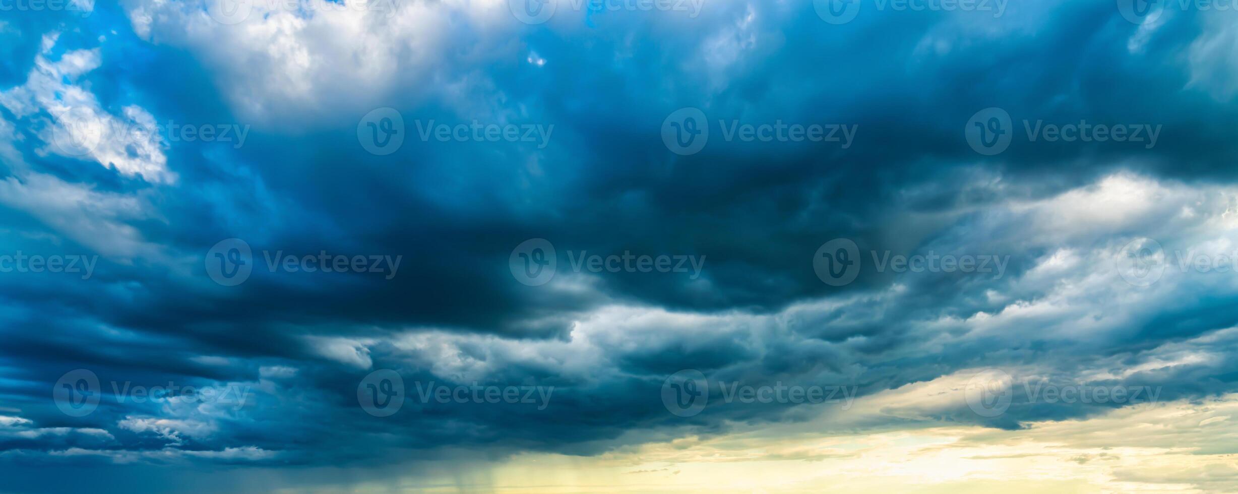 An approaching thunderstorm in a flowering rapeseed field. photo