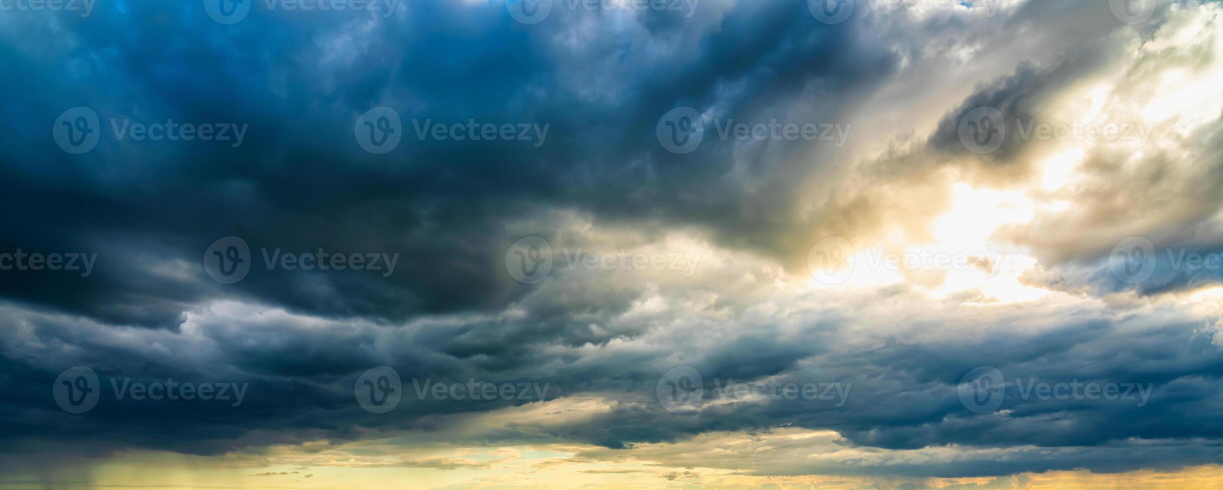 An approaching thunderstorm in a flowering rapeseed field. photo