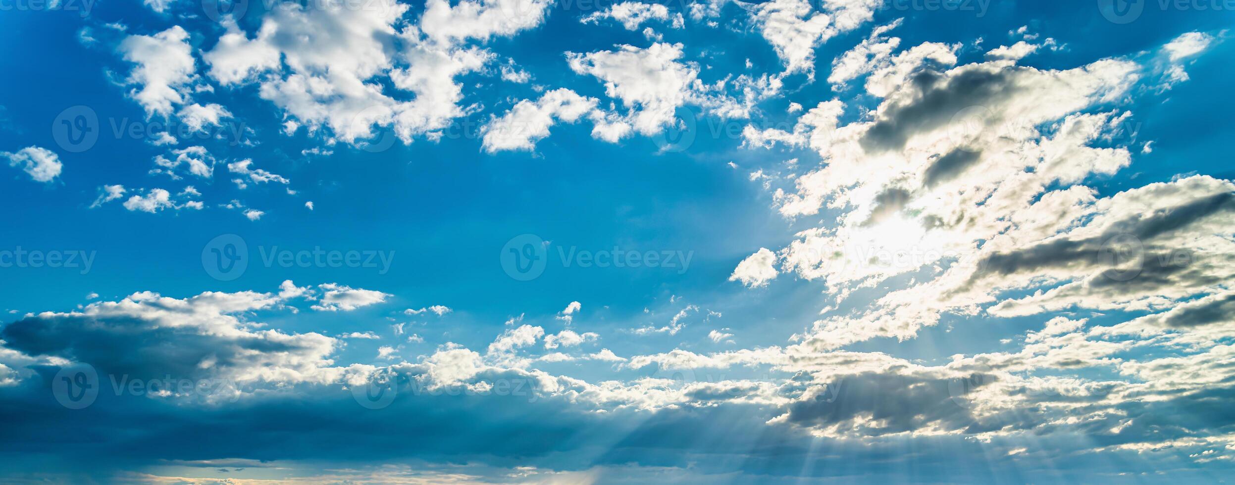 Sunbeams breaking through the clouds in a rapeseed field. photo