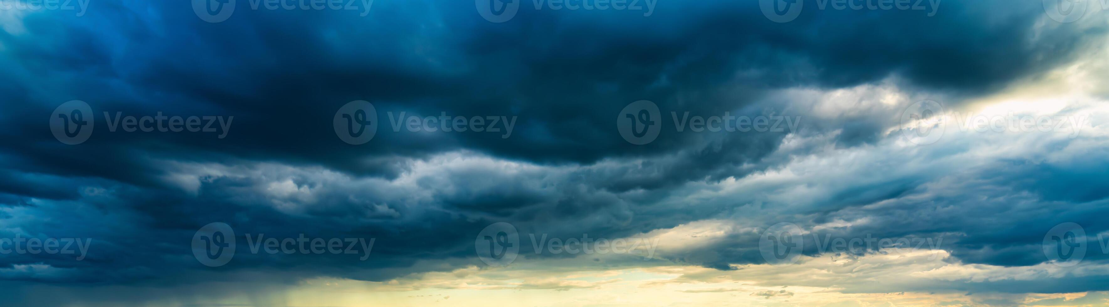 An approaching thunderstorm in a flowering rapeseed field. photo