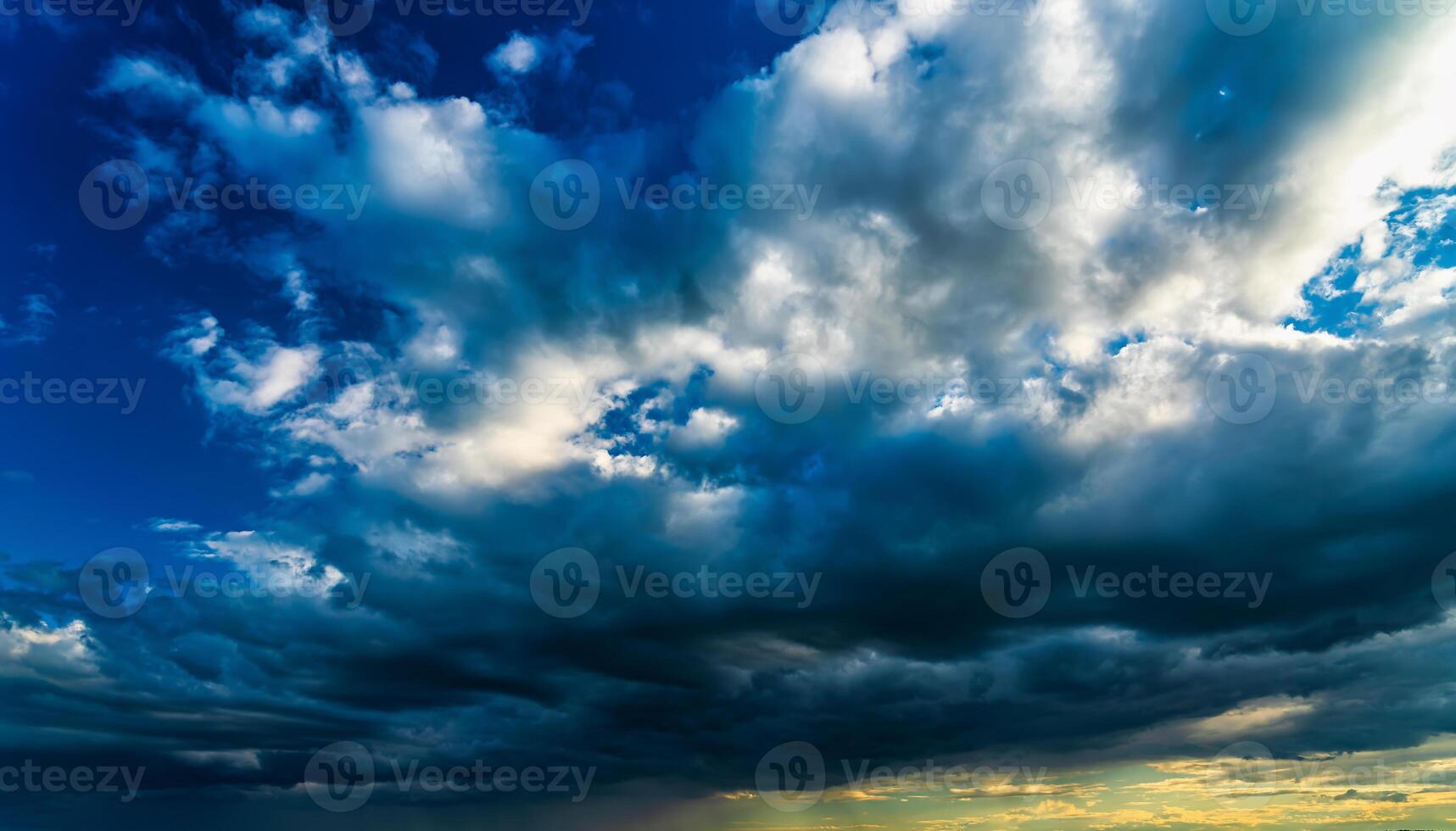 An approaching thunderstorm in a flowering rapeseed field. photo