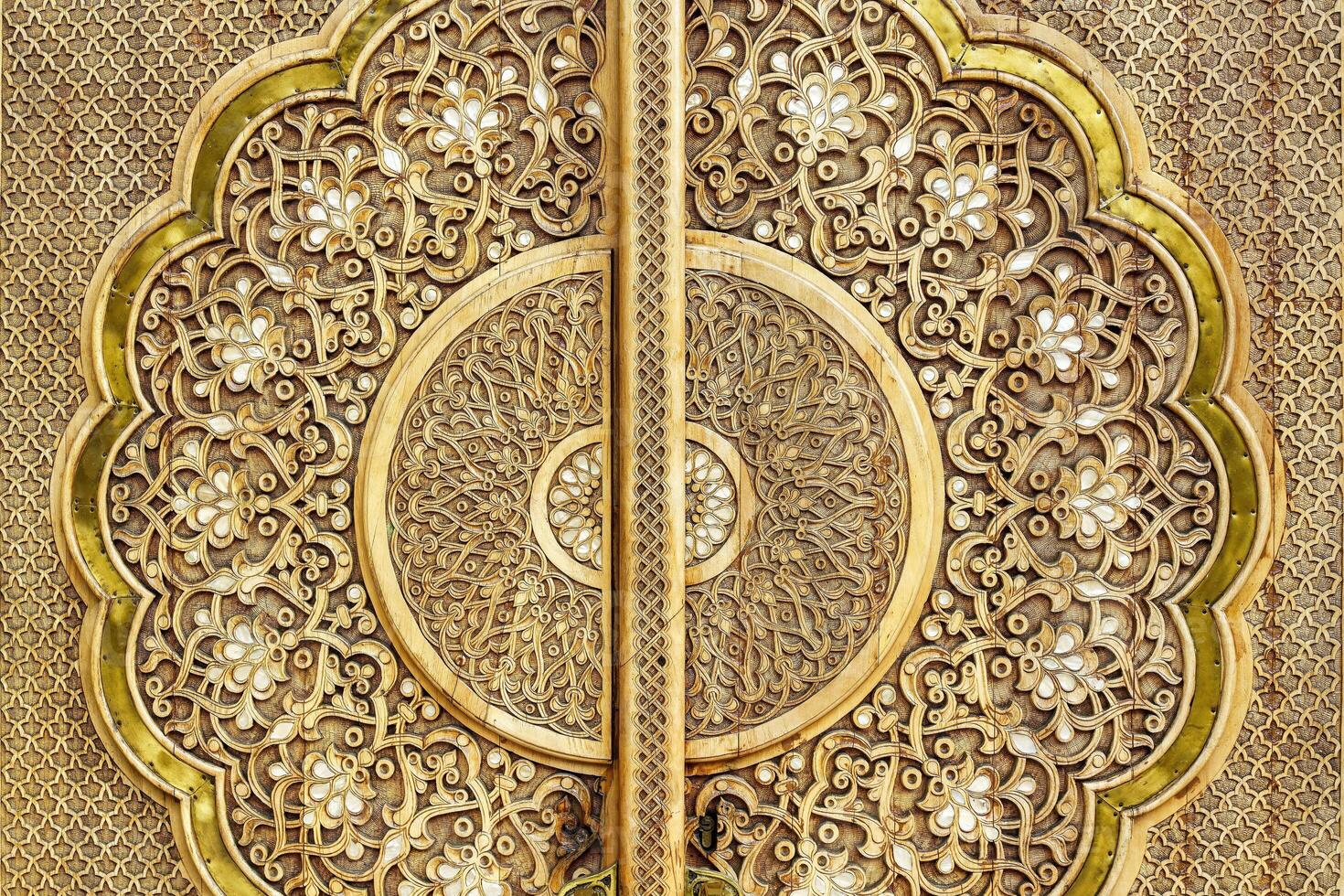 Carved wooden doors with patterns and mosaics. photo