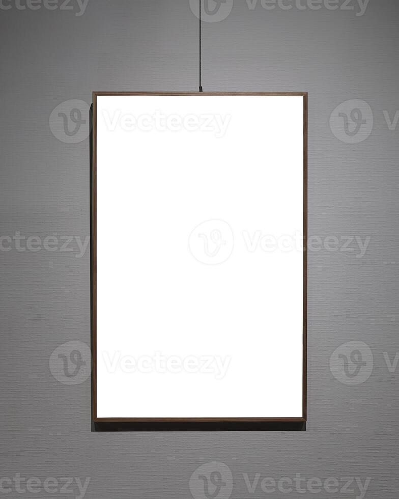 Picture frames with copy space for text hanging on the wall with wallpaper. Mockup for design. photo