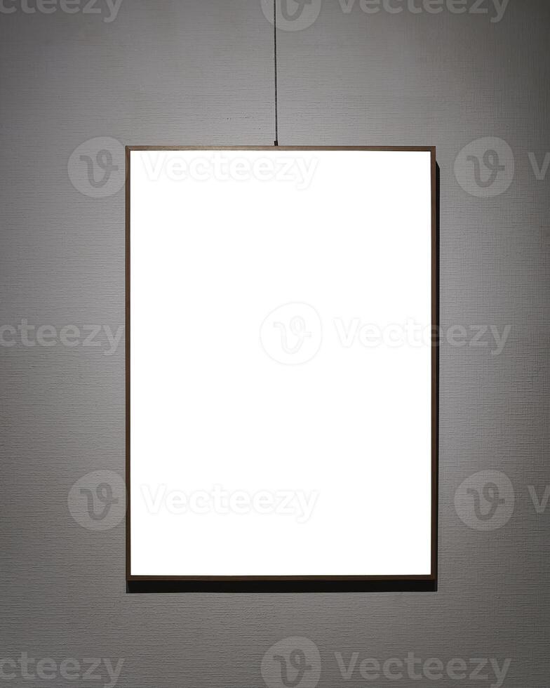 Picture frames with copy space for text hanging on the wall with wallpaper. Mockup for design. photo