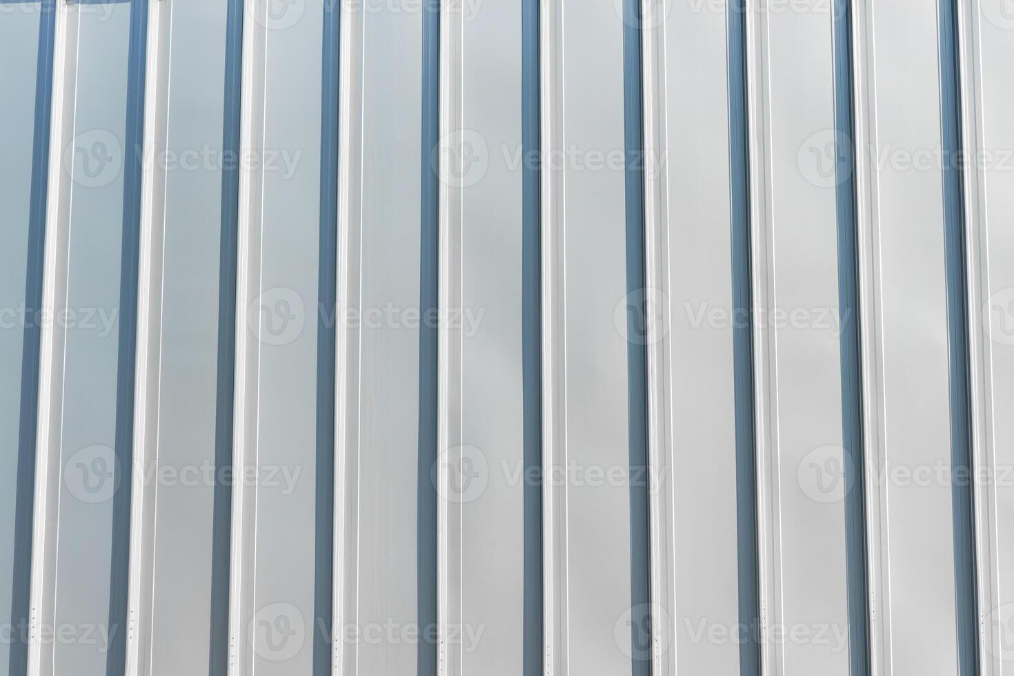 The texture of the cladding of the building from metal aluminum panels. Abstract background. photo