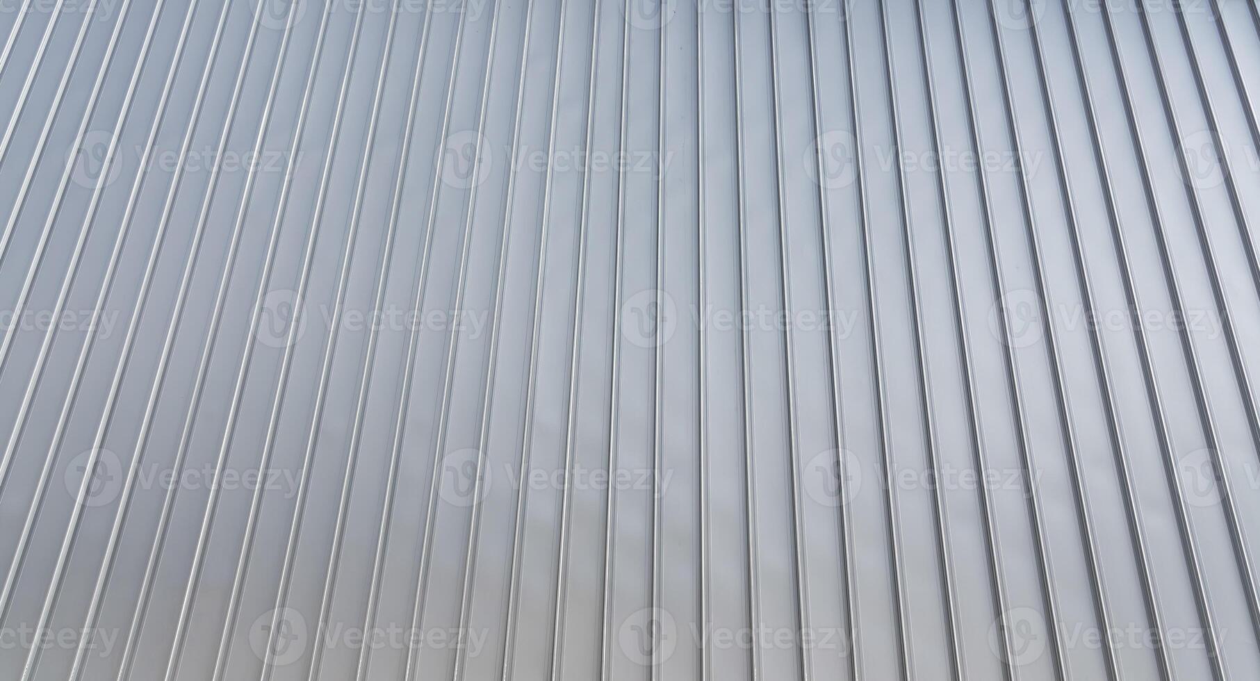 The texture of the cladding of the building from metal aluminum panels. Abstract background. photo