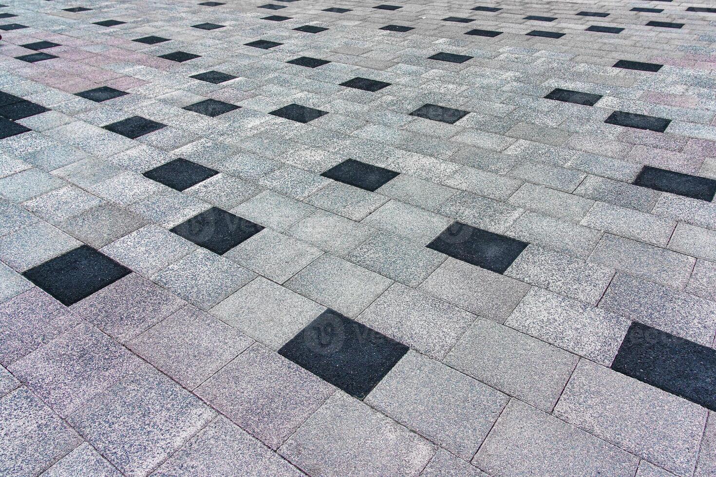 The texture of a tiled pavement with perspective. photo