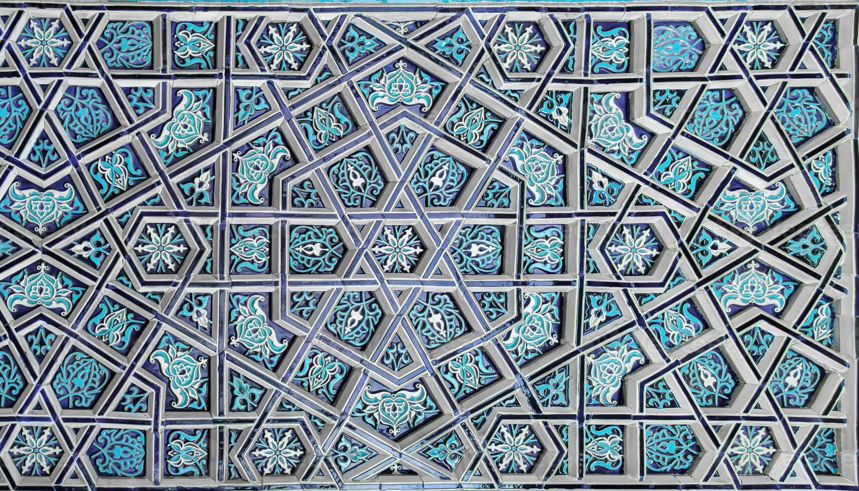 Geometric traditional Islamic ornament. Fragment of a ceramic mosaic. photo