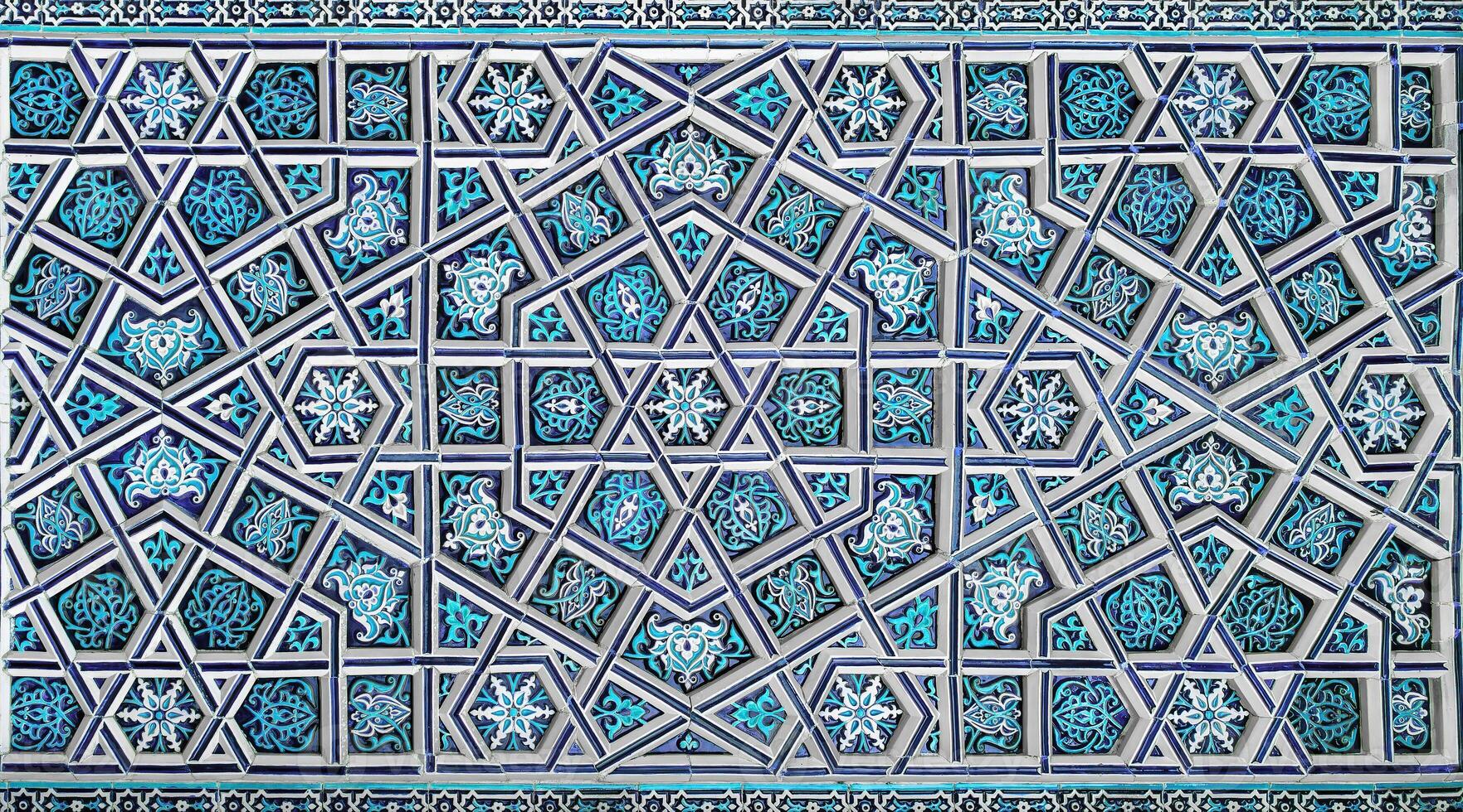 Geometric traditional Islamic ornament. Fragment of a ceramic mosaic. photo