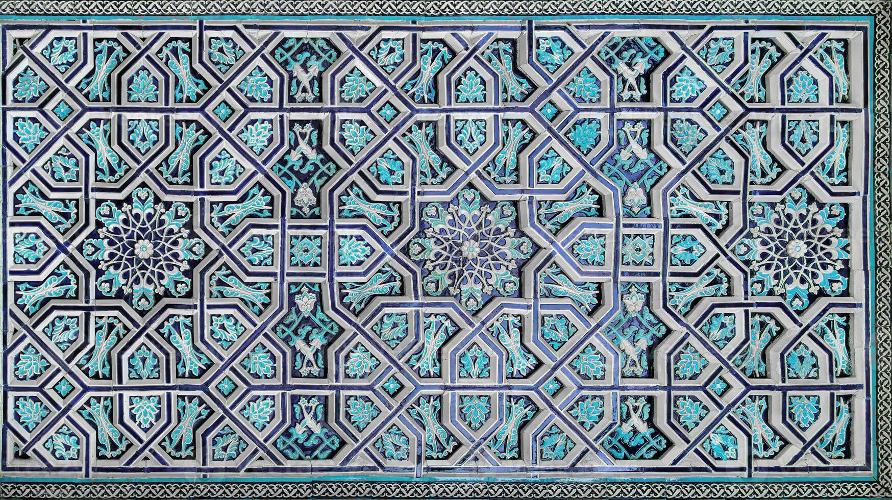 Geometric traditional Islamic ornament. Fragment of a ceramic mosaic. photo