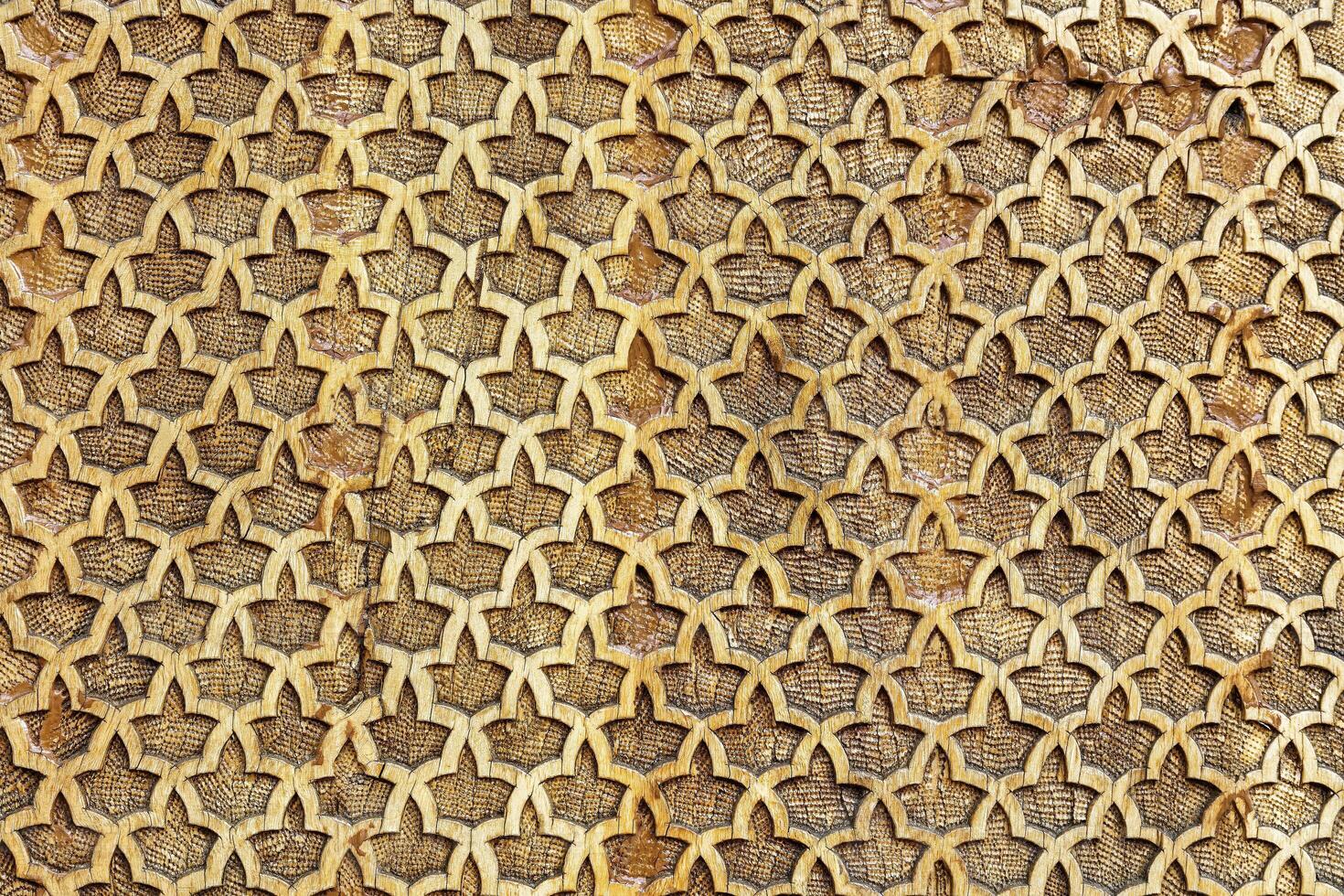 Fragment of an ancient carved wooden pattern. Ornate. Abstract background. photo