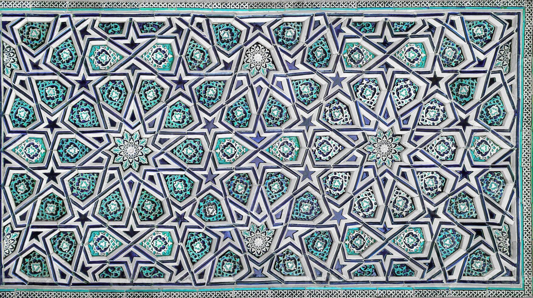 Geometric traditional Islamic ornament. Fragment of a ceramic mosaic. photo