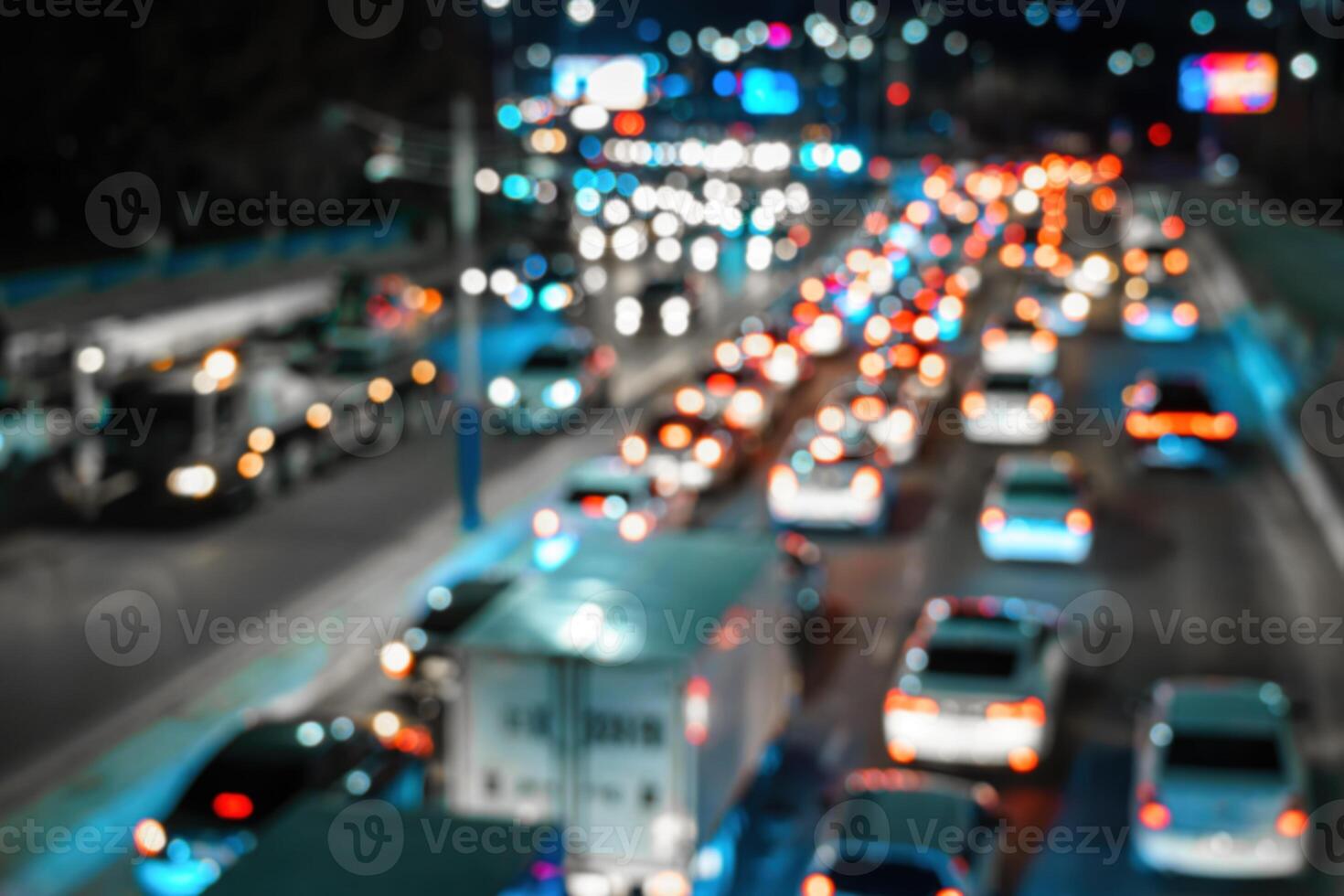 Blurred car traffic light at night city. Traffic jam in evening rush hour. photo