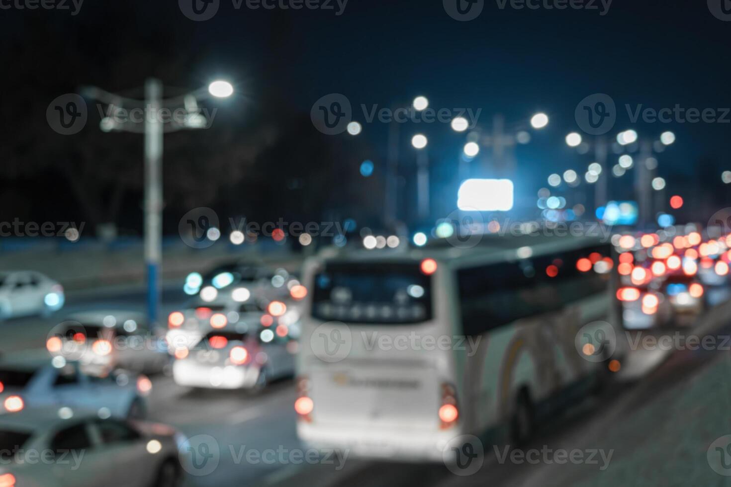 Blurred car traffic light at night city. Traffic jam in evening rush hour. photo