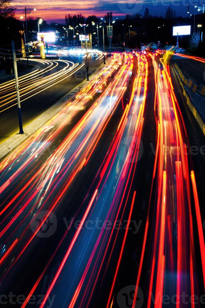 Car traffic light at night city. photo