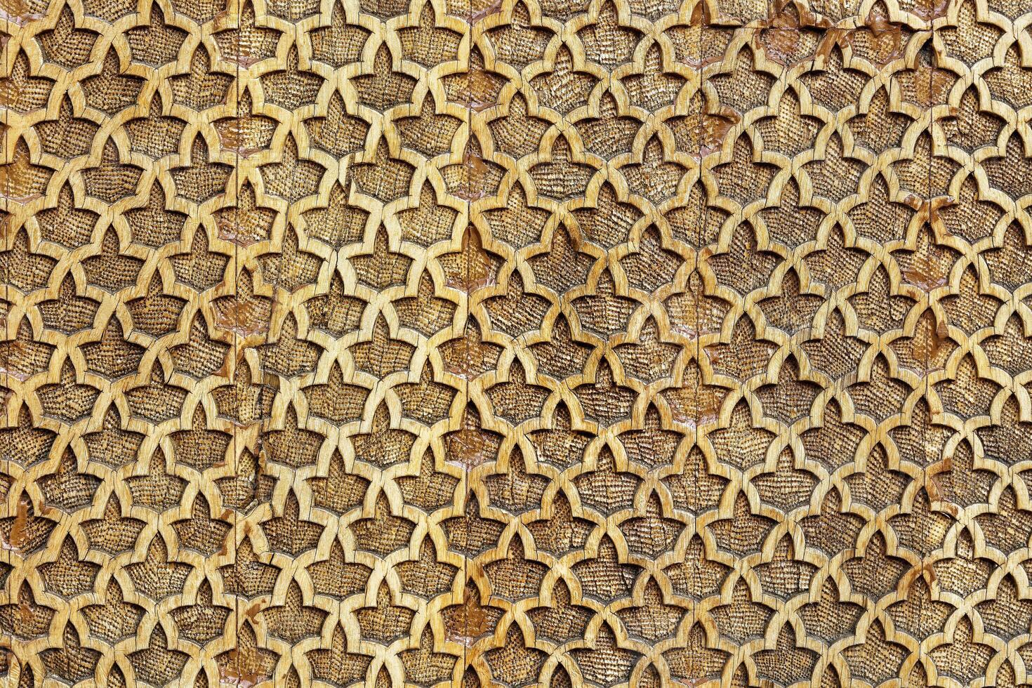 Fragment of an ancient carved wooden pattern. Ornate. Abstract background. photo