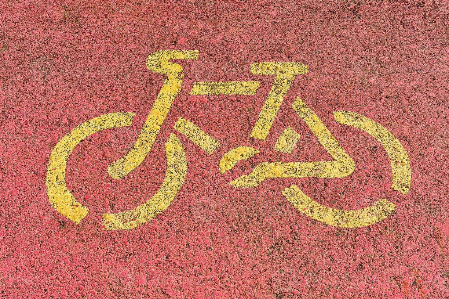 Bicycle path sign on an asphalt road. photo