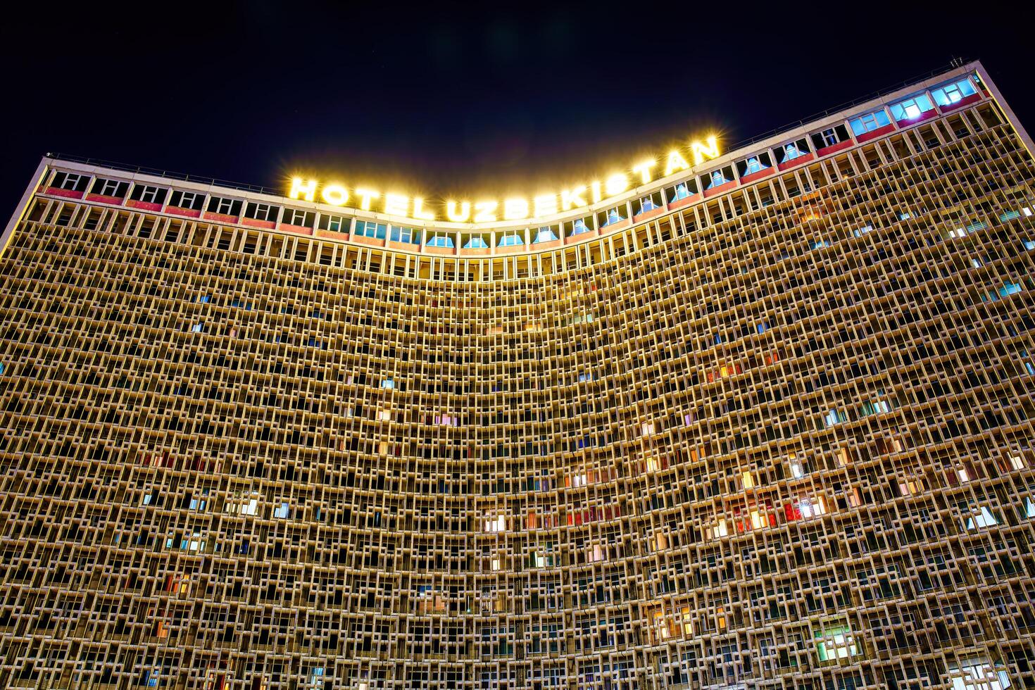 Tashkent, Uzbekistan - March 14, 2023 View to facade of Hotel Uzbekistan in Tashkent at nighttime. photo