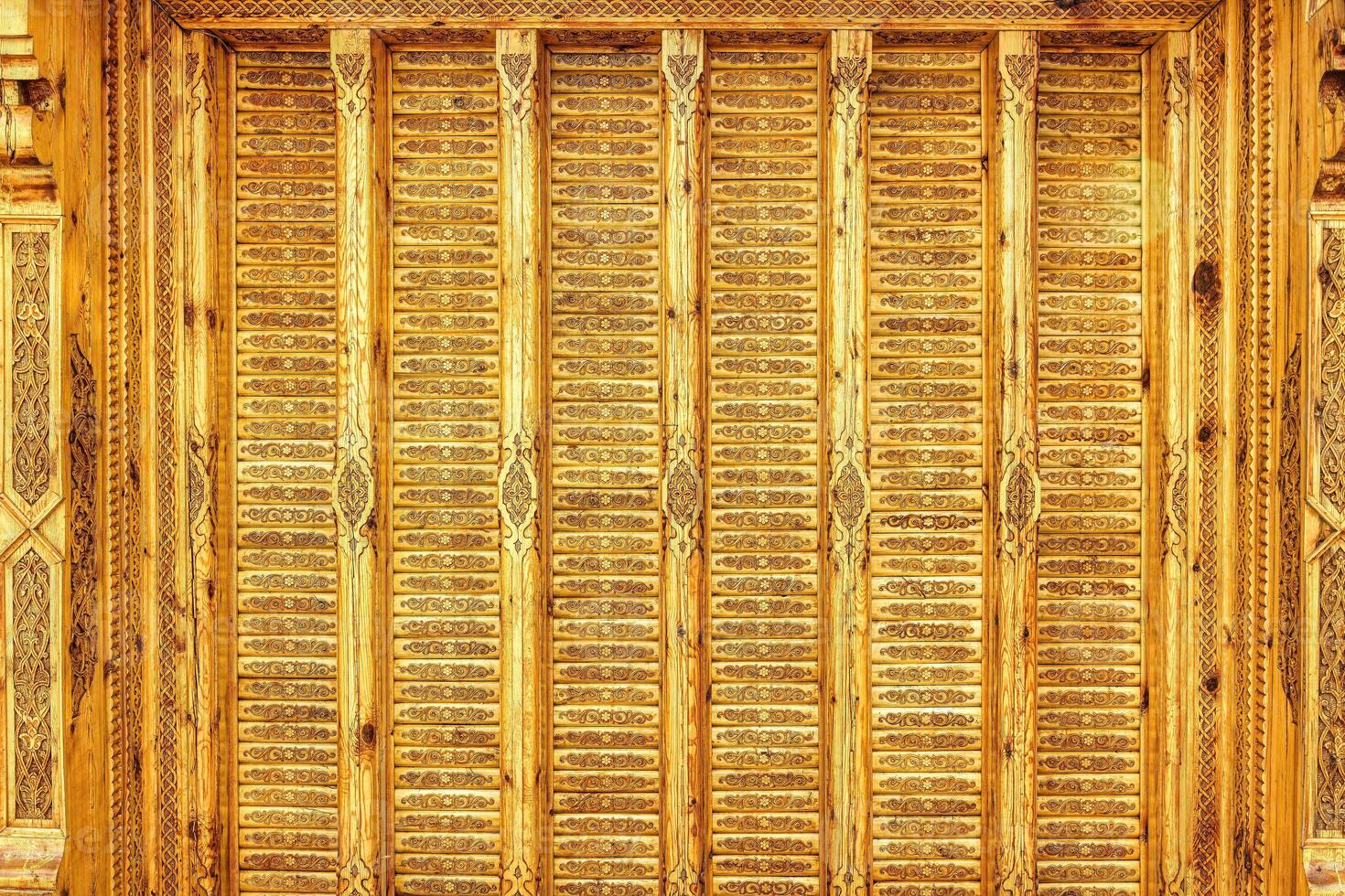 Fragment of an ancient carved wooden pattern. Ornate. Abstract background. photo