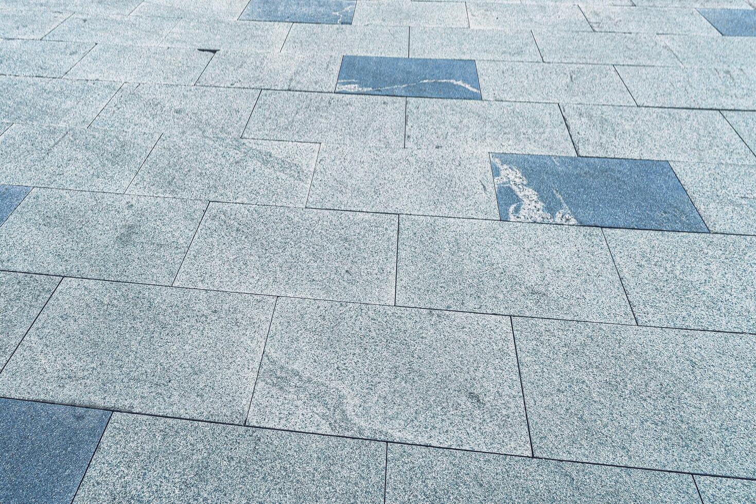 The texture of a tiled pavement with perspective. photo