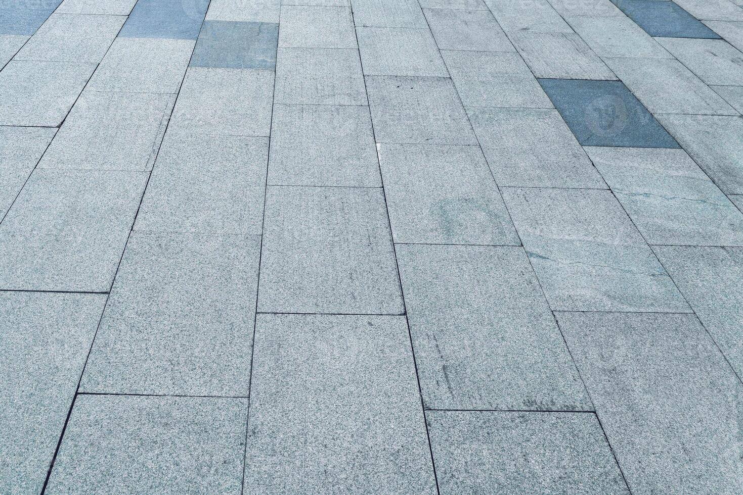 The texture of a tiled pavement with perspective. photo