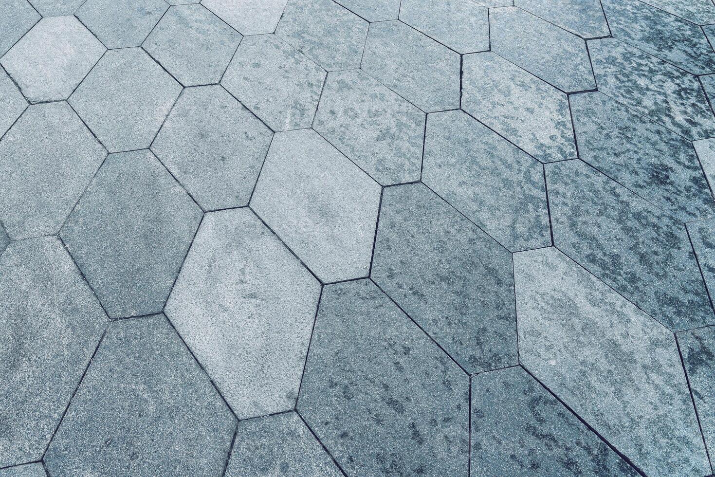 The texture of hexagonal tiled pavement with perspective. photo