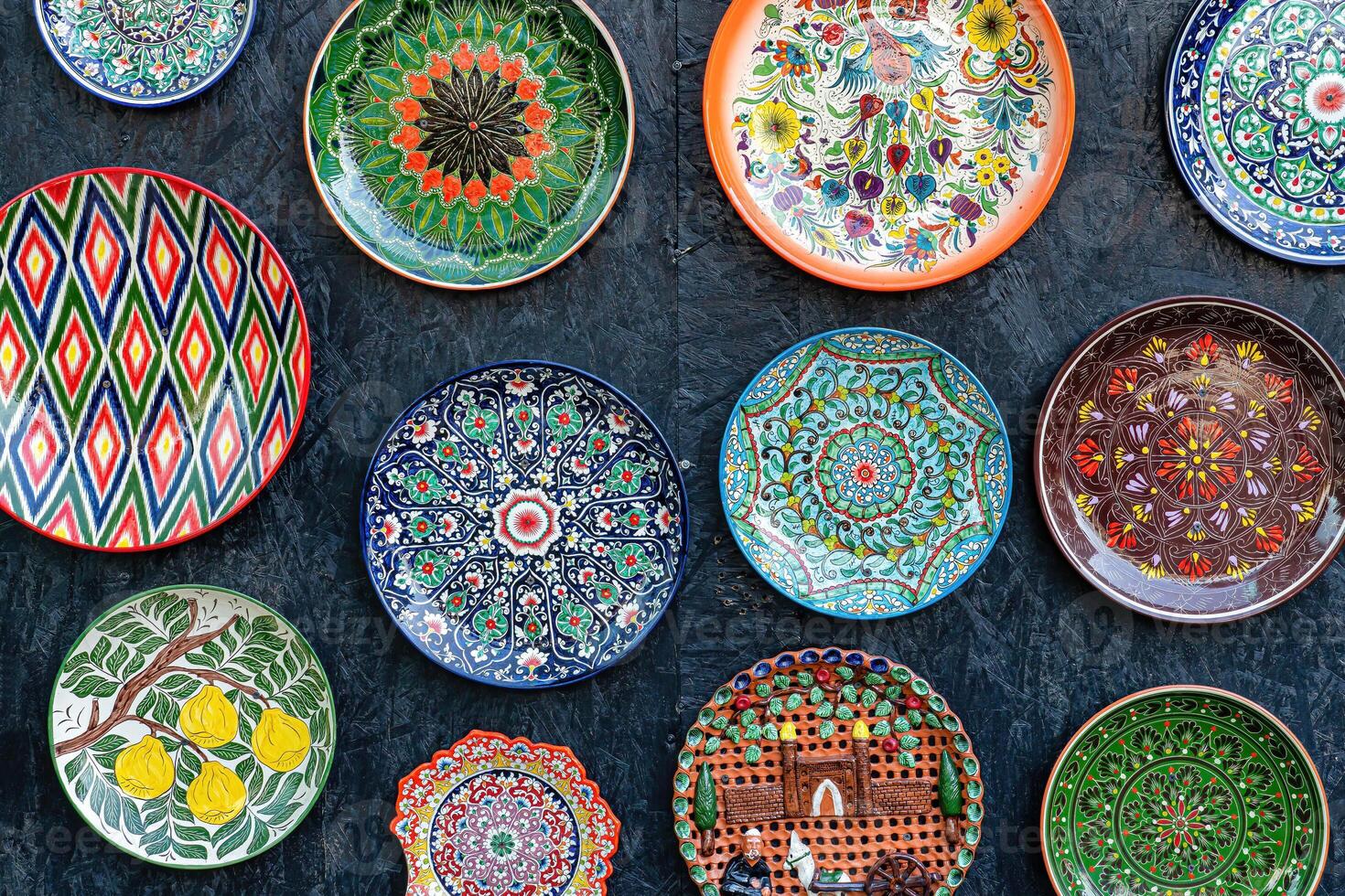 Arabic painted ceramic plates on the wall. photo