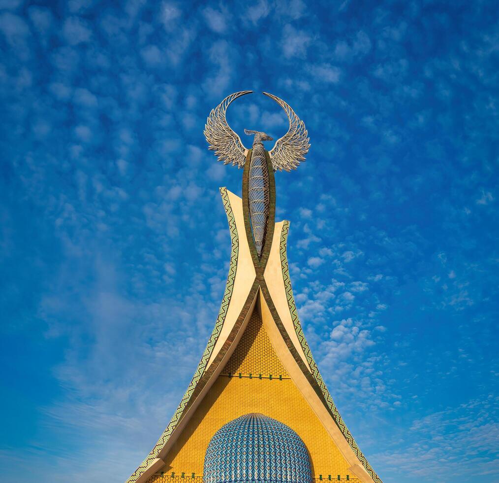UZBEKISTAN, TASHKENT - JANUARY 4, 2023 Monument of Independence in the form of a stele with a Humo bird in the New Uzbekistan park. photo