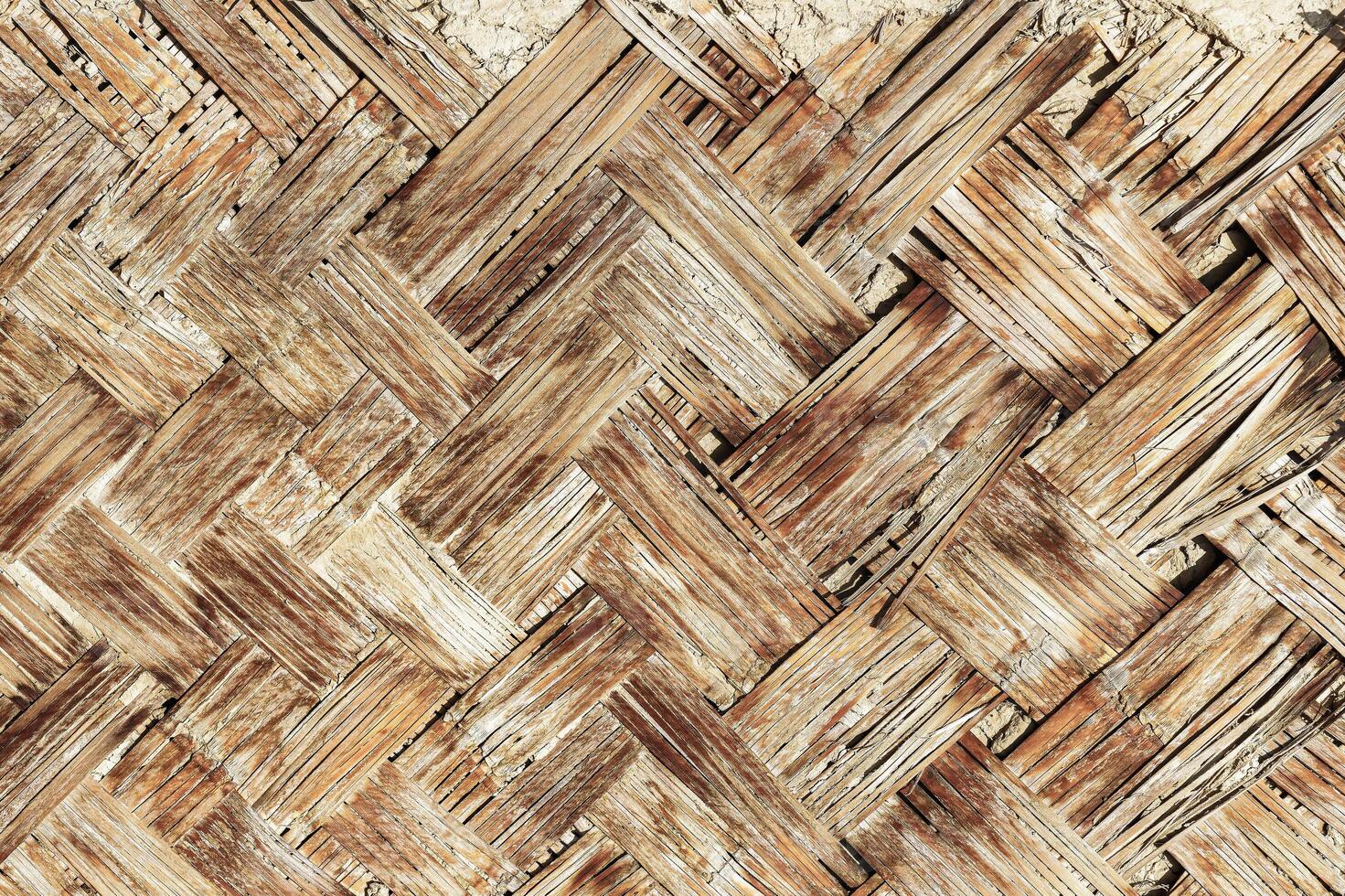 The texture of the frame of an oriental building made of woven bamboo. Abstract background. photo