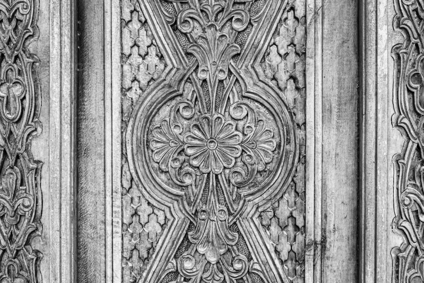 Carved wooden doors with patterns and mosaics. photo
