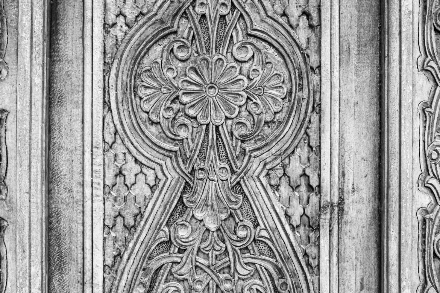 Carved wooden doors with patterns and mosaics. photo