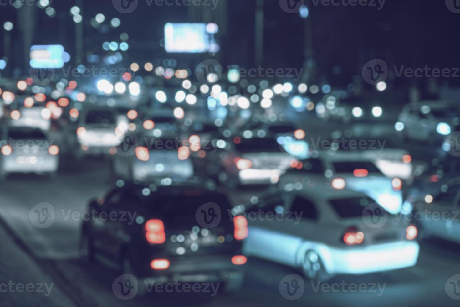 Blurred car traffic light at night city. Traffic jam in evening rush hour. photo