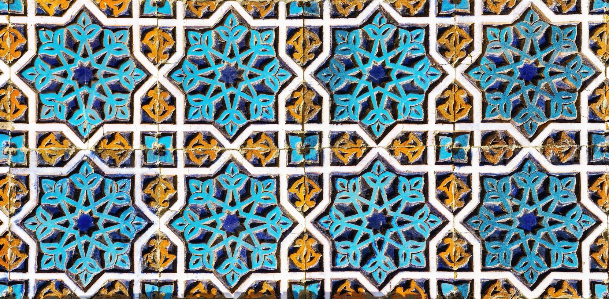 Geometric traditional Islamic ornament. Fragment of a ceramic mosaic. photo