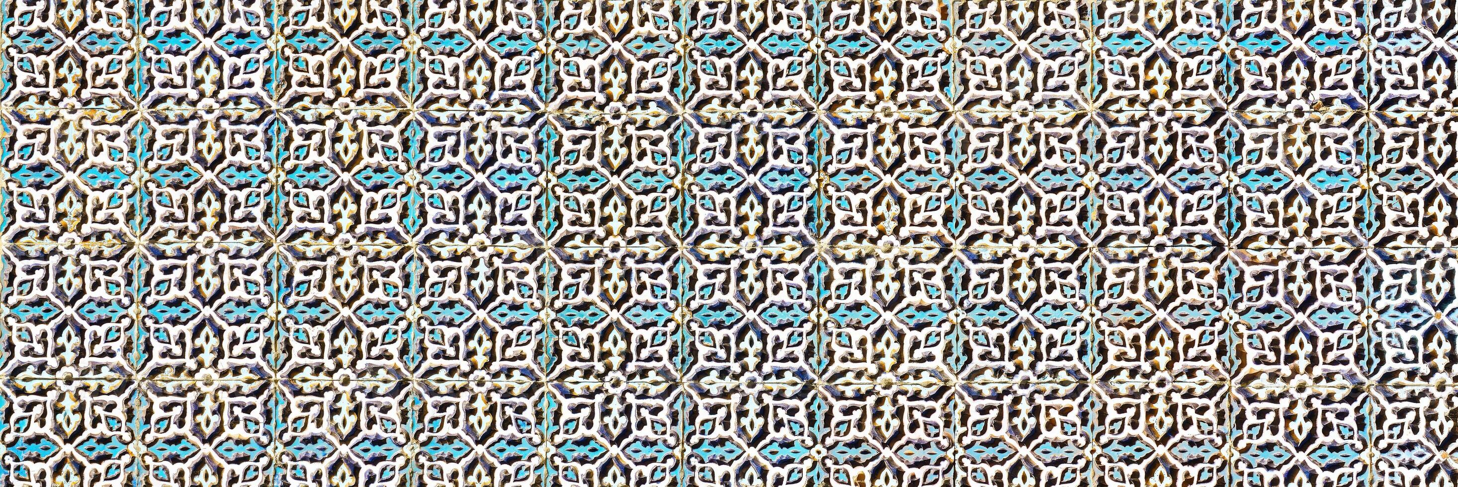 Geometric traditional Islamic ornament. Fragment of a ceramic mosaic. photo